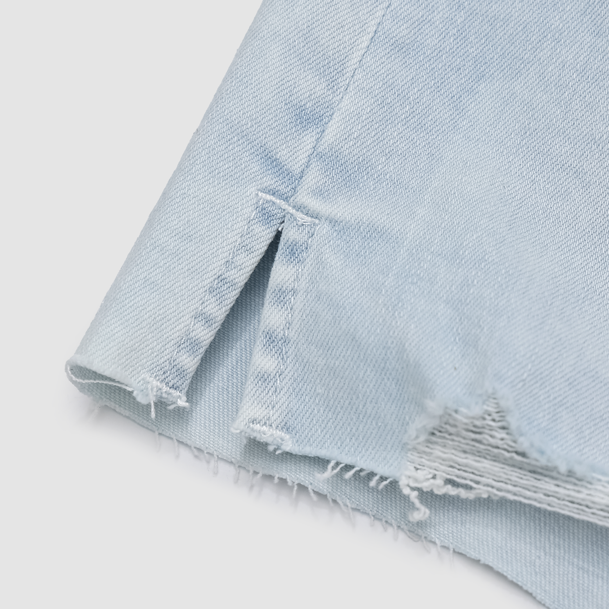 Kaleigh Distressed Hem Denim Shorts in Light Indigo